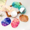 Espejo Ovalado con Patrón de Mármol de Nuevo Modelo Transfronterizo, Espejo de Maquillaje para Belleza, Espejo Giratorio Portátil de Colores con Peine Plano Integrado