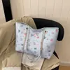 Bolsa feminina estilo grafite 2026 nova moda estudante universitário versátil bolsa de ombro bolsa tote de grande capacidade