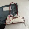 Bolsa de Axila Estilo Doce Coreano com Bolinhas e Laço para Mulheres Moda Verão 2026 Bolsa de Mão Simples Bolsa Versátil