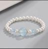 Pulsera de cuentas de primavera, nueva, de nicho, de alta gama, diseño original, joyería de perlas de imitación, pulsera de cristal de polvo de caballo, venta al por mayor