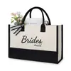 Bolsa de Lona para Boda Transfronteriza con Múltiples Personajes, Bolsa de Mano para Novia/Sra. con Moño en Contraste Blanco y Negro