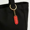 Estilo Nacional Creativo Texto Inspirador Llavero de Metal Ovalado Bendición Llavero de Coche Exquisito Colgante de Bolso Regalo