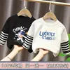 Ropa para niños para niños, camiseta de manga larga de retazos, imitación de dos piezas, camiseta base de algodón puro para niños mayores, nuevo estilo de top para primavera y otoño 2026