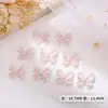 Decoración de arte de uñas de moda con forma de ojo de gato hueco y lazo con piedra de ojo de gato de aleación 3D y accesorios de mariposa para uñas