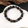 Europa y Estados Unidos pulsera tejida transfronteriza caliente ojo de tigre de piedra negra moda personalidad vidrio hombres y mujeres joyería de cuentas al por mayor
