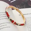 Nuevo brazalete estilo chino de esmalte con goteo de aceite para mujer, pulsera versátil pintada artísticamente vintage, superventas transfronterizo, joyería de moda de lujo ligero