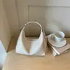Bolso liso de color para axila estilo perezoso 2026 verano nuevo bolso tipo empanada alta para el trabajo y el trayecto bandolera