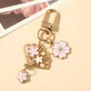 Chaveiro Leque Dobrável Estilo Japonês Flor de Cerejeira Cruzando a Fronteira Coelhinho de Jade Doce Flor Pingente de Metal Chaveiro Decoração de Bolsa Presente