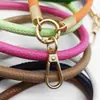 Pulseira de celular em couro PU outono novo, cordão curto para celular, corrente de celular anti-queda e anti-perda para uso externo, atacado