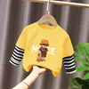 Camiseta de manga larga de algodón puro para niño 2026 primavera y otoño nueva elegante de dibujos animados estilo dos piezas falsas camiseta base de primavera para niño
