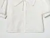 Al por mayor Primavera 2026 Nuevo Estilo Europeo y Americano Camisa Blanca Corta de Mujer con Cuello Redondo 5221