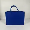 2026 Bolso de Fieltro Año Nuevo Logo Personalizado Bolsa de Regalo Corporativo Souvenir Portátil Gran Capacidad Bolso de Fieltro