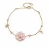 Pulsera y anillo chapados en oro real de 18 quilates, diseño de flor de goteo de aceite y cordero, un accesorio lujoso y de alta gama para el dedo índice