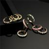 Suministro transfronterizo Aogu Moda europea y americana Cobre micro incrustado joyería de circonita color mixto goteo de aceite geométrico anillo abierto para mujer