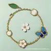 Pulsera de Mariquita de Siete Estrellas Multicolor Esmaltada Serie de Lujo Ligero Más Vendida Transfronteriza para Mujer, Pulsera de Mariquita de Cinco Flores de Nácar de Doble Cara