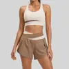 Traje deportivo de fitness de dos piezas falsas a juego de colores Juyitang para correr, traje de ropa de yoga desnudo