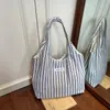 Bolsa de Lona Rayada de Gran Capacidad para Mujer 2025 Nueva Moda Tendencia Versátil Bolso de Hombro Casual Bolso Tote para Viajes Cotidianos Suave