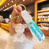 Llavero de oso luminoso de acrílico de gelatina de moda roja, lindo colgante para mochila de pareja, regalo pequeño para máquina de garra, venta al por mayor