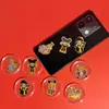 Pegatinas para Teléfono Móvil Serie Pop Mart de Oro Puro 999 Disponibles para Venta al por Mayor, y Regalos Personalizados con Artesanía de Lámina de Oro Disponibles