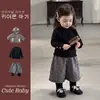 Conjunto súper elegante de chaqueta de plumón y pantalones para niñas, nuevo estilo de invierno, pantalones largos a cuadros de dos piezas falsas, capa base versátil, conjunto de tres piezas, moderno