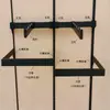 Accesorios para teléfonos móviles negros al por mayor Columna AA Columna de escalera Tubo cuadrado Izquierda y derecha Soporte Tienda de ropa Colgante lateral Colgante de cinco clavos Gancho largo
