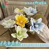 Magnolia artificial de EVA con tacto realista, magnolia de tallo largo de cuatro cabezas flor artificial, venta al por mayor transfronteriza, decoración de arreglo floral para el hogar estilo chino