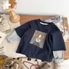 Camiseta Falsa de Dos Piezas para Niños Otoño Nuevo Estilo Niños y Niñas Dibujos Animados Manga Corta Patchwork Superior Ropa de Otoño para Bebé Capa Base Moderna