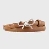 Cinturón versátil con lazo para mujer, estilo coreano, diseño simple, moderno cinturón delgado de cuero, ajustable con broches, disponible en stock