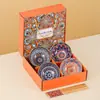Juego de tazones y palillos de color bajo cubierta bohemio transfronterizo Juego de tazones de cerámica Abertura de tazón Vajilla Caja de regalo Souvenir Venta al por mayor