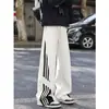 Pantalones deportivos casuales de retazos a rayas estilo americano para hombre, pantalones rectos holgados para deportes de otoño, pantalones de pierna ancha fluidos con bloques de color de moda