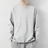 Camiseta de manga larga de color liso para hombre, estilo americano, otoño, amigable con la piel, moderna, versátil, camiseta básica, top pullover casual de cuello redondo