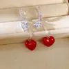 Aretes de borla en forma de corazón de vidrio con incrustaciones de circonita, únicos y elegantes, aretes versátiles de nicho, sensación de lujo ligero y alta gama, venta al por mayor