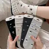 Calcetines de estilo rústico para mujer hasta la mitad de la pantorrilla, estampado floral, sin costuras, algodón puro, estilo japonés, estilo primavera y otoño, calcetines largos blancos con borde enrollado