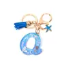 Llavero Colgante Temático Océano Azul con Borla de Estrella de Mar, Llavero de Resina Encanto para Bolso con 26 Letras