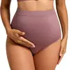 Pantalones de maternidad sin costuras de tiro alto, diseñados para dar soporte al abdomen durante el embarazo y el posparto, disponibles en tallas grandes, transpirables, muy elásticos y con un ajuste que abraza las caderas sin apretar y sin marcar la ropa interior.