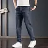 Jeans elásticos al por mayor transfronterizos para hombre, estilo coreano, ajustados rectos, de moda, casual para hombre, pantalones largos de primavera y otoño
