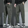 Pantalones casuales de marca de moda para hombre verano 2023 nuevos estilo coreano modernos holgados rectos cropped overol fino para hombre