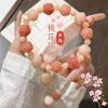 Pulsera de bodhi de flor flotante en polvo natural para hombres y mujeres camelia anillo individual pulsera de mano cuentas cuentas texto placa de juego cuerda venta al por mayor