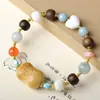 Pulsera de Múltiples Piedras Preciosas con Cuentas de Fruta Marfil Cocidas al Carbón, Combinadas con Corazón de Astas de Ciervo, Ágata Roja del Sur, Jade de Tianshan y Madera de Ágar para Venta al por Mayor para Mujeres
