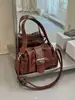 Bolso de Motocicleta Retro de Nicho Bajo el Brazo para Mujer 2026 Nuevo Estilo Bolso de Mano de Alta Gama Versátil Bolso de Hombro Cruzado
