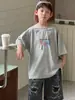 Tienda de Algodón Camiseta para Niños Verano Manga Corta Estilo Coreano 2026 Nueva Suave Absorbente de Sudor Versátil Moda de Verano Tendencia en Ropa para Niños