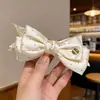 Pinza Plátano Plisada Vertical con Lazo Floral para Cola de Caballo de Verano 2026 Nuevos Pasadores para la Parte Posterior de la Cabeza Accesorios para el Cabello