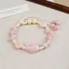Jingdezhen Navidad Pulsera de Cuerda Trenzada de Cerámica Pulsera de Trébol de Cuatro Hojas Joyería Artística Hecha a Mano Venta al por Mayor Pulseras de Cerámica para Atracciones Turísticas