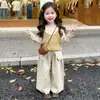 Camisola de punto multicapa de color liso para niñas coreanas 2026 otoño nuevo conjunto casual versátil de tres piezas