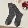 Calcetines de mujer de caña media otoño e invierno patrón de cáñamo calcetines de Navidad bordado de muñeco de nieve moda todo a juego calcetines de felpa Zhuji