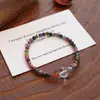 Pulsera de turmalina natural para mujer, pulsera de ámbar y cristal blanco, pulsera de cordón elástico simple estilo chino nuevo de jade Hetian al por mayor