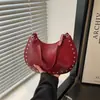 Bolsa de Mão de Nicho para Mulheres 2026 Novo Modelo de Primavera Alta Qualidade Texturizada Rebite Tendência Casual Bolsa de Ombro