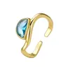 Anillo Abierto de Zirconia Azul Forma de Gota Estilo Europeo y Americano Transfronterizo, Chapado en Cobre con Oro de 14K, Anillo de Lujo Ligero Ajustable de Onda Irregular