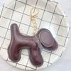 Fabricantes suministran nuevo colgante creativo de dibujos animados lindo de algodón relleno de cuero U perrito para bolso de mujer llavero colgante pequeño