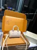 2026 Nuevo Modelo m Marca Bolso Mini Almohada para Mujer, Bolso de Mano y Bolso Cruzado de Cuero Genuino, Bolso de Cadena con Monograma de Alta Gama
